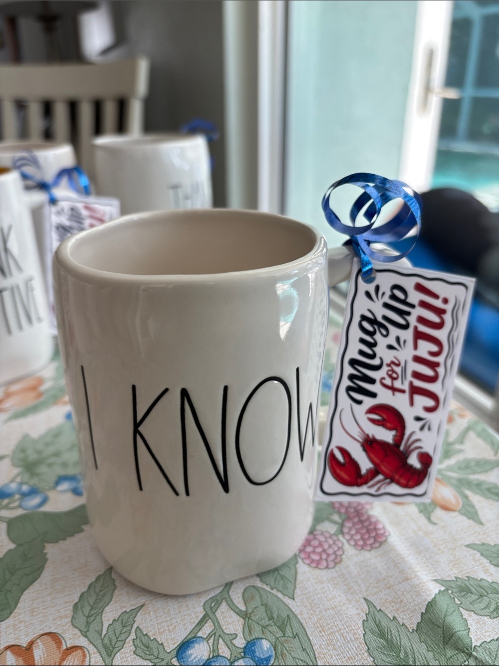 Rae Dunn Cream 'I KNOW' Ceramic Mug with Blue Ribbon and Red Tag